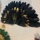 Large decorative fan made of natural feathers