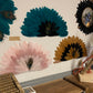 Large decorative fan made of natural feathers