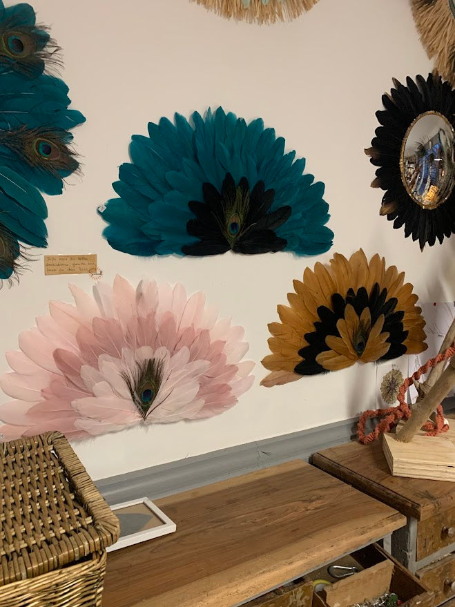 Large decorative fan made of natural feathers