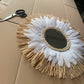 Decorative wall mirror in raffia and "daisy" feathers