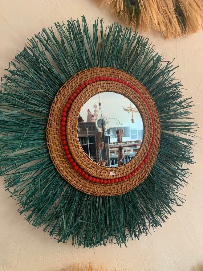 Mirror made of ultramarine blue raffia, rattan and raw wooden beads