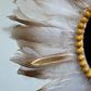 detail plumes blanches dorées
