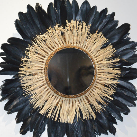 Large round raffia mirror and black feathers