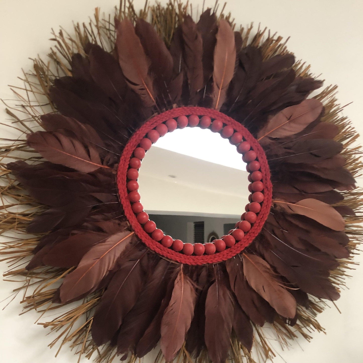 Mirror with chocolate feathers and red pearls