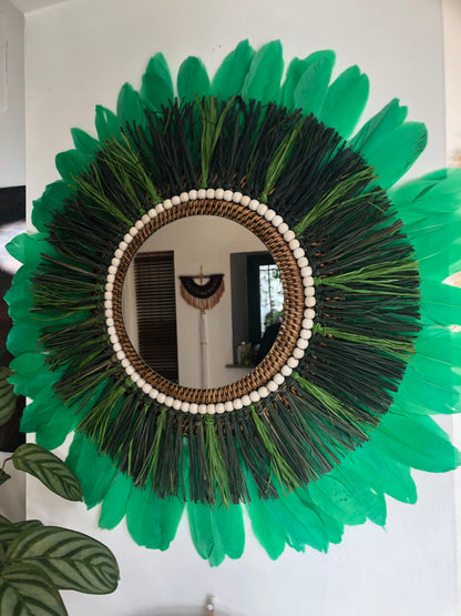 Woody-scented mirror, green raffia and feathers